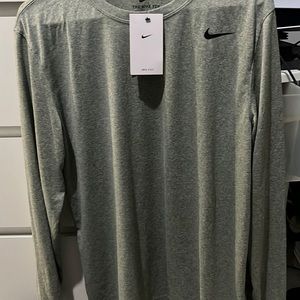 Brand New Nike gray long sleeve dri-fit tee.